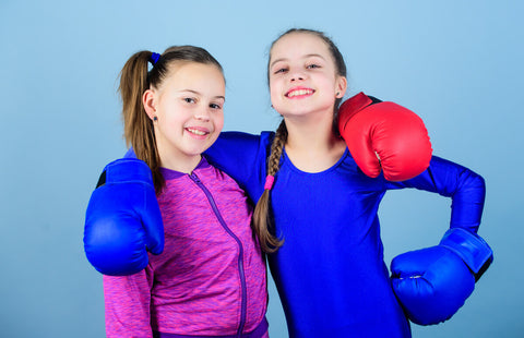 Best multivitamin for kids: 2 kids wearing boxing gloves