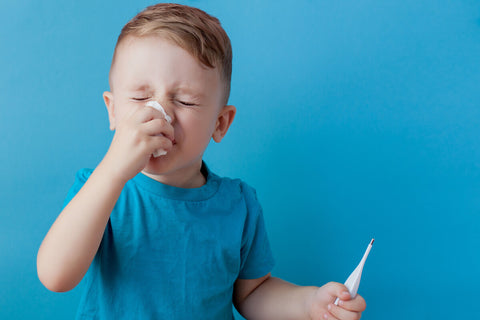 Can you take elderberry daily: boy holding a thermometer