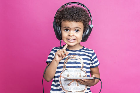 Folic acid for kids: little kid wearing headphones