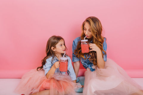 Folic acid for kids: mother and daughter drinking shakes