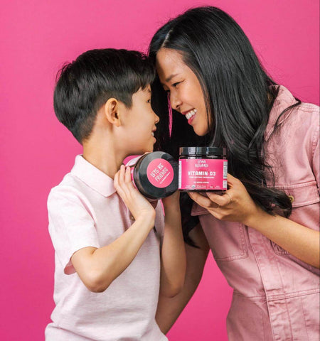 Mother and son holding a jar of Llama Naturals