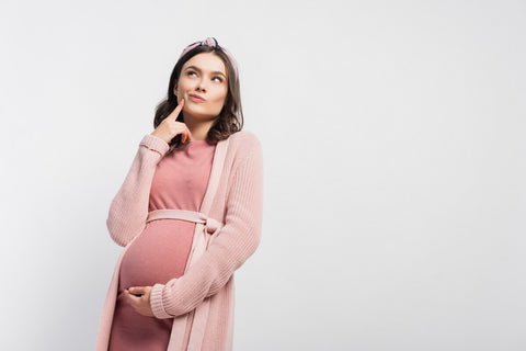 Pregnant woman thinking about folic acid for kids