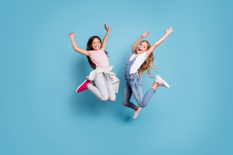 Vitamin A for kids: two girls jumping