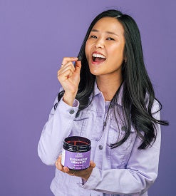 Woman holding Llama's Elderberry Gummies