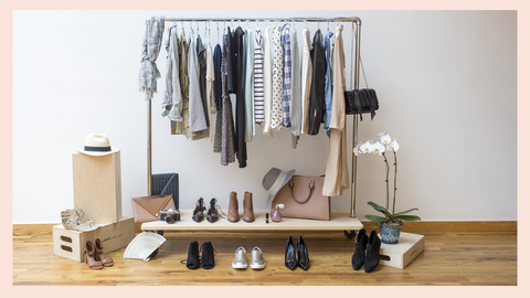 Image of a capsule wardrobe on a clothing rack