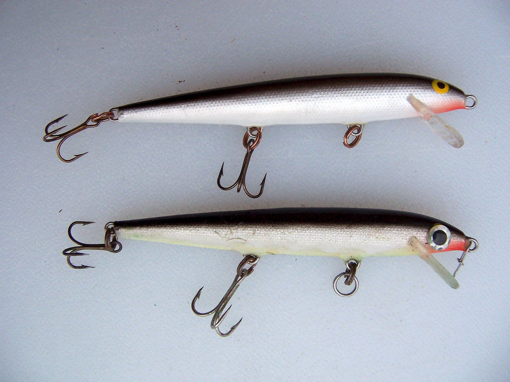 A tuned F11 Rapala, bottom and a Rapala with stock hooks, middle and rear.