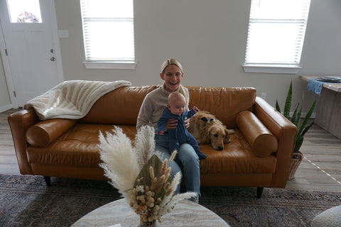 Mother and son sitting on leather couch