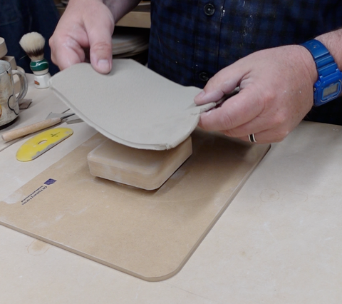 Placing clay on top of Wallie Form