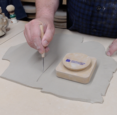 Cutting clay slab with loonie knife