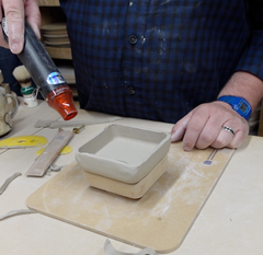 Using a drying tool to dry out the clay