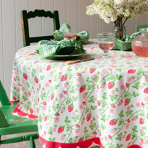 Strawberry round table cloth laid for a special celebration