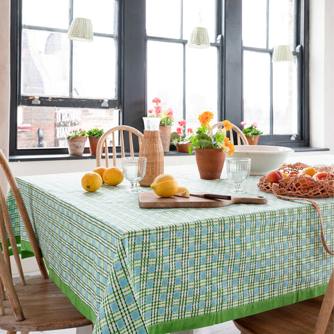 Molly Mahon Table Cloth Trellis Green laid in a bright kitchen bring the best of the new spring colours indoors