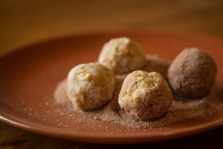 Roll your balls in the cocoa powder until they're completely covered.