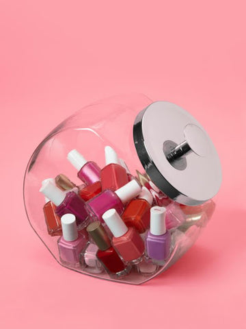 Glass jar filled with nail polish, bathroom hacks for relaxation