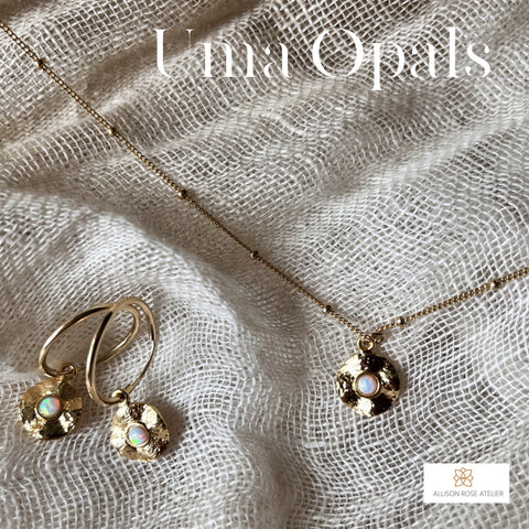 This gold opal style coin gold necklace is a must-have for adding a discreet touch of shine. Each dainty pendant is inlaid with CZ stones and features an intricate sunburst etching. Opal coin hangs from a delicate 14k gold filled chain