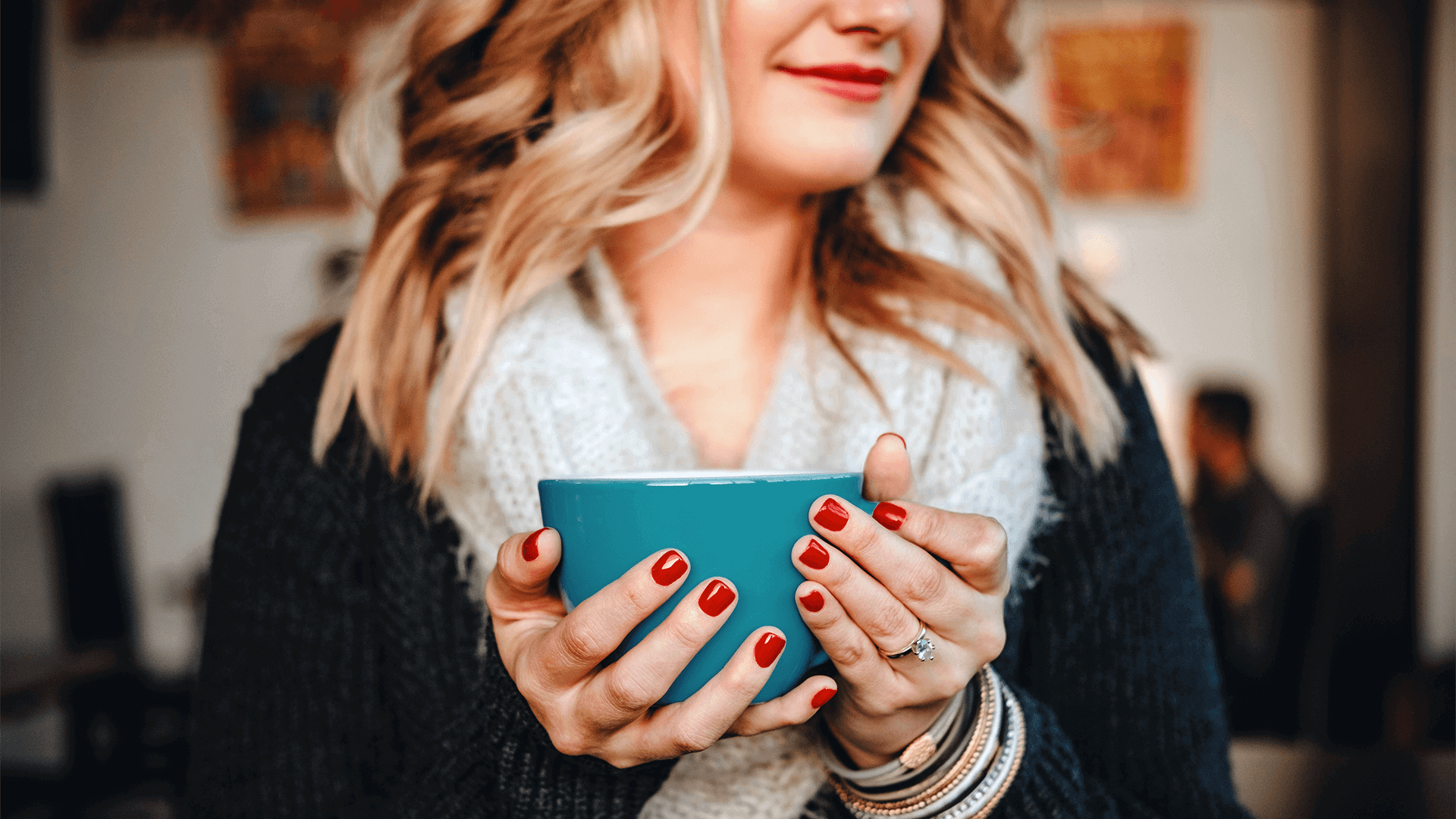 Smiling woman holding coffee cup 