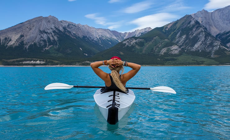 Woman kayaking getting back to nature with Tauri-Gum
