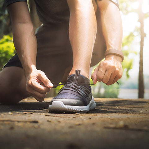 man tying his shoes