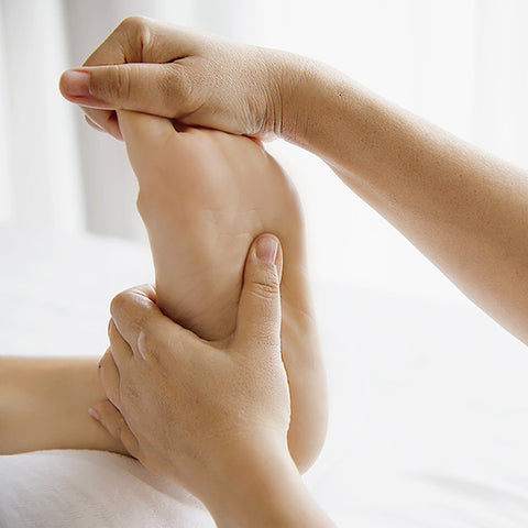 person doing foot massage