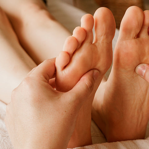 person doing foot massage