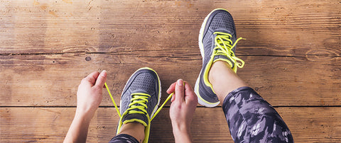 person tying shoes