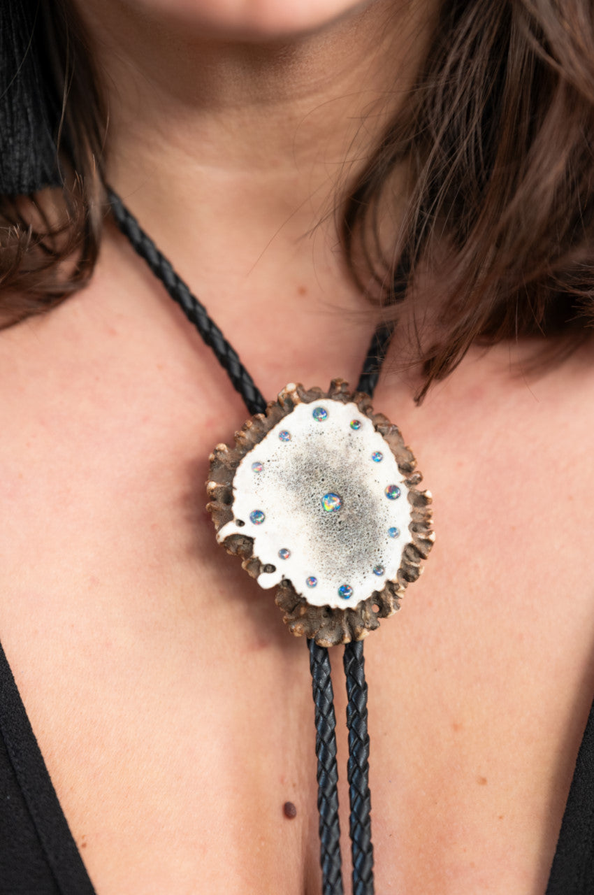 Woman wearing an Australian Black Opal and Elk Antler Bolo Tie