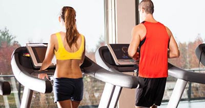 Man and woman on treadmill