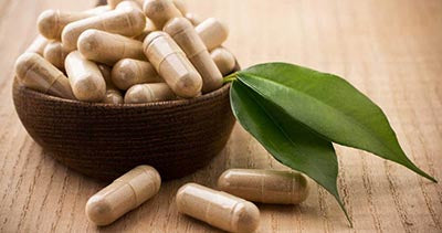ashwagandha capsules with a leaf