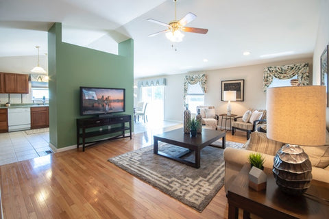 Home living room with green walls and complete furniture