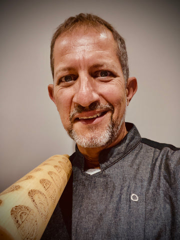 Chef Gennaro holding his embossing rolling pin