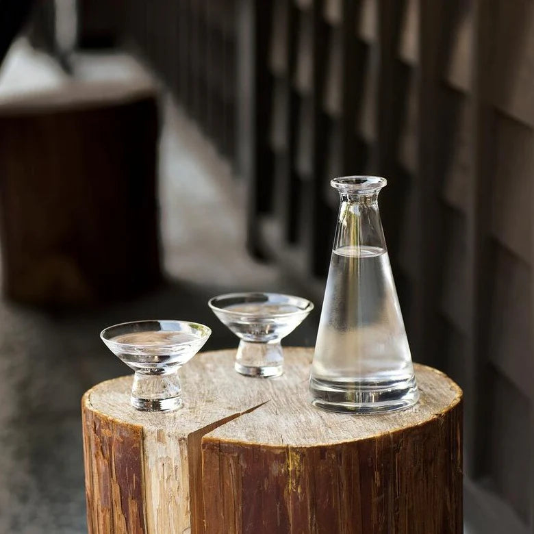 Hirota Glass Sake Set on a wooden side table