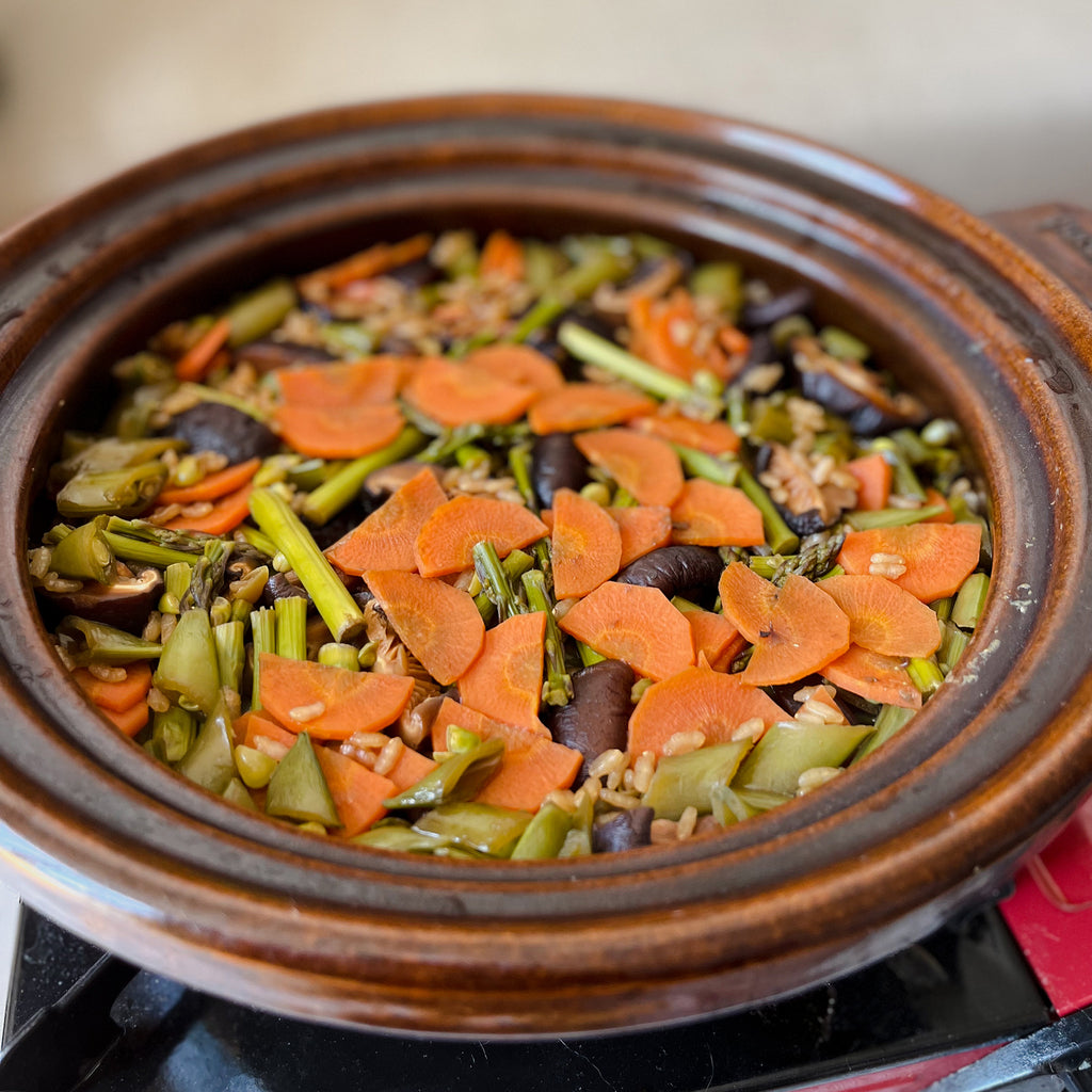 Spring vegetable donabe rice in a donabe pot