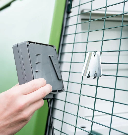 The Omlet Autodoor includes a bracket that can be hung on mesh, or fastened to your DIY coop.