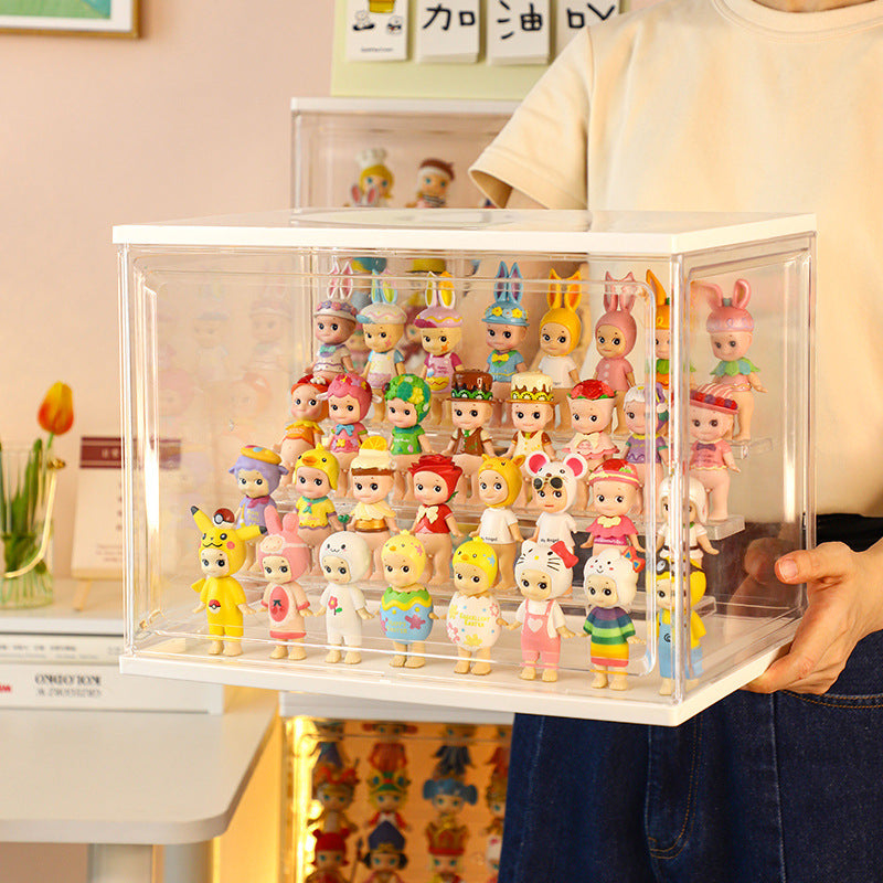 Someone is holding a large display box full of Sonny Angels, that are standing on acrylic shelves inside the box