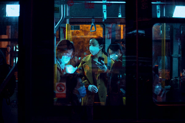 People wearing N95 Masks on a train