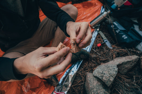 Person eating a Datrex Ration Bar