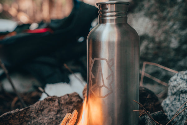 Stainless steel water bottle over fire