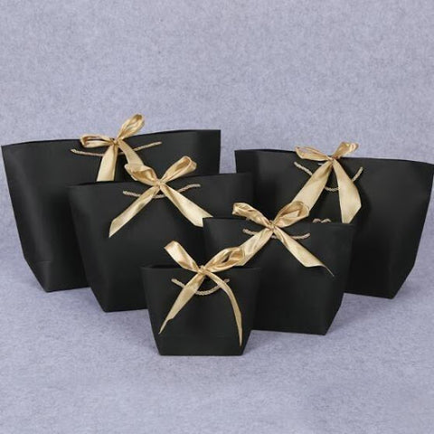 an image of black and gold luxury gift bags