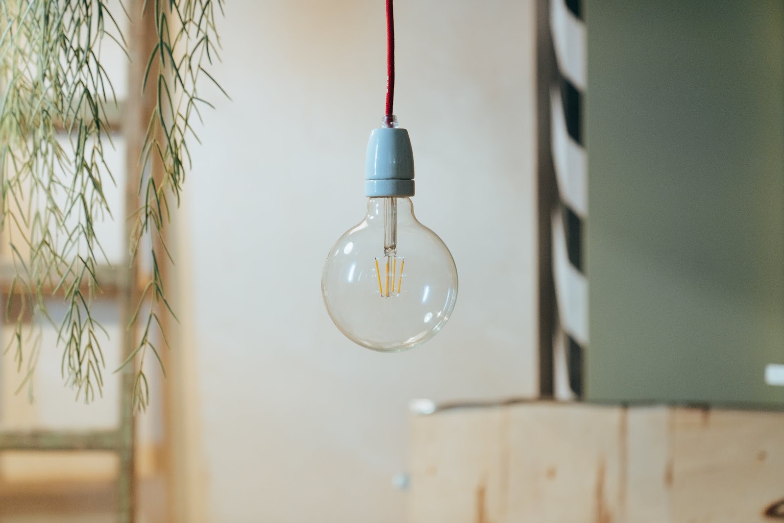 An unlit light bulb against a blurred background