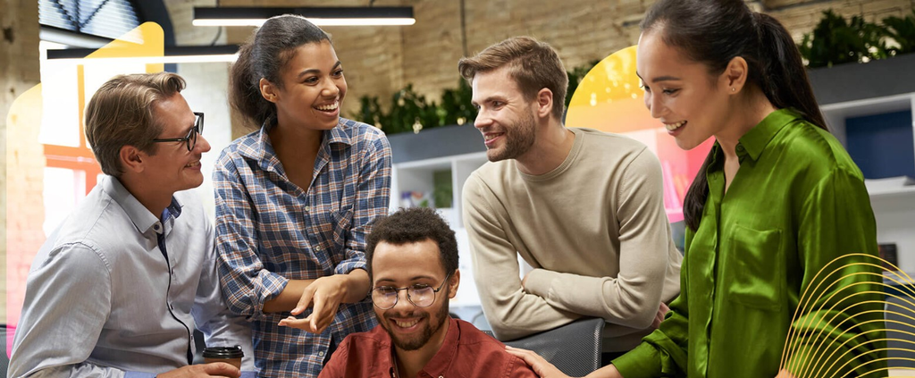 a group of friends and co-workers talking and laughing together