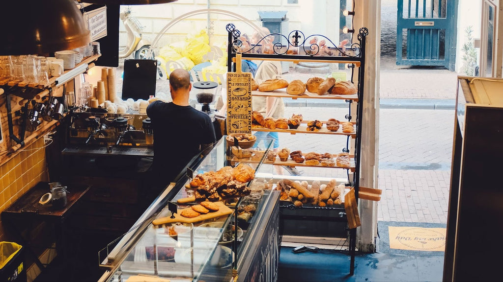Overhead shot of a man busy working in a small bakeshop