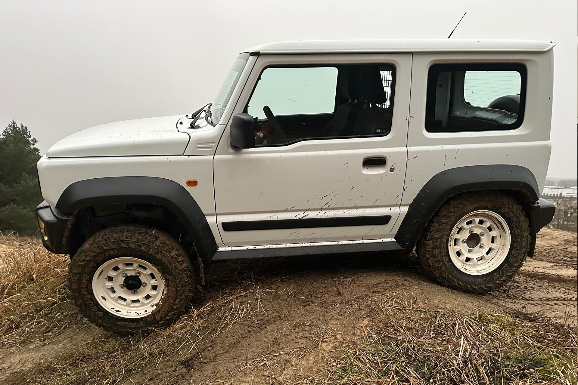 White Suzuki Jimny fitted with Vintage White High Peak J-01 Wheels
