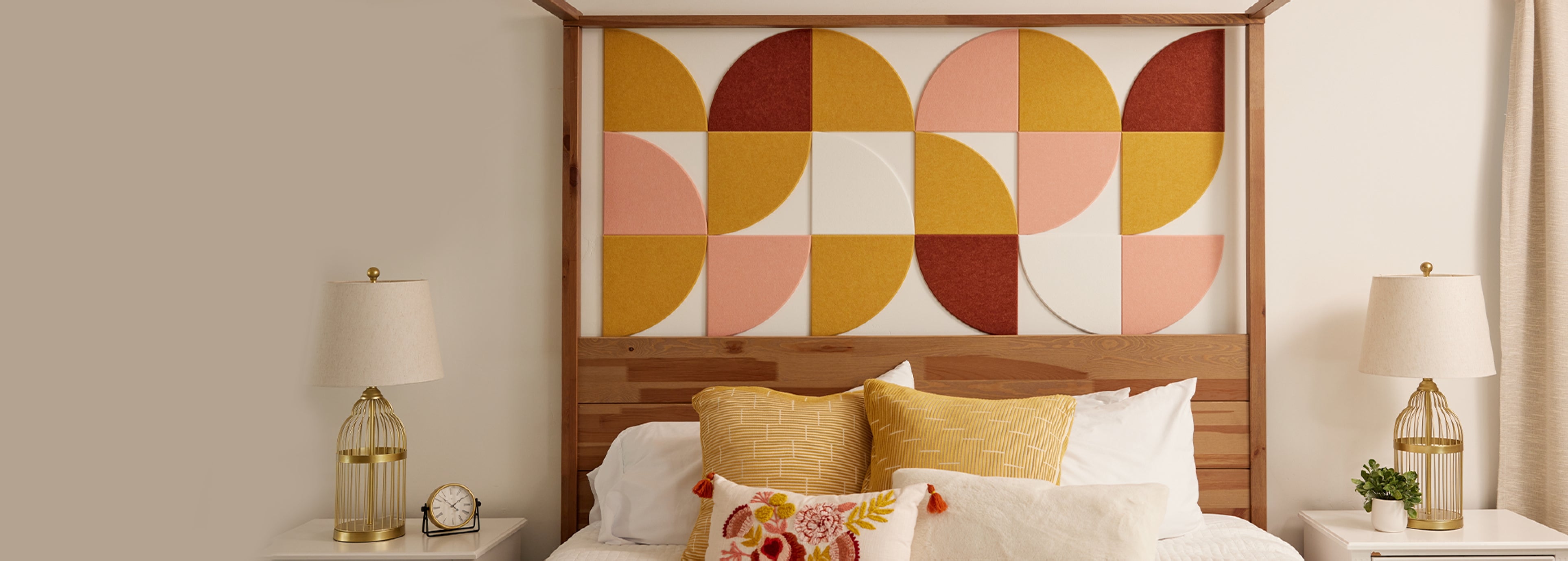 Bed with a large, vibrant headboard felt design