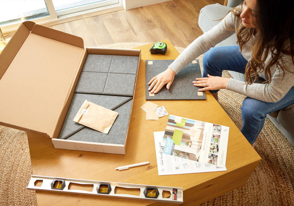 Woman opening Felt Right box.