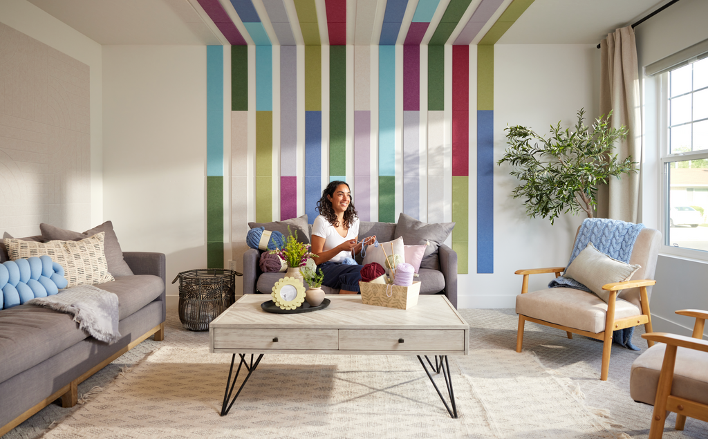 Colorful vertical Felt Right tiles that extend to the ceiling.