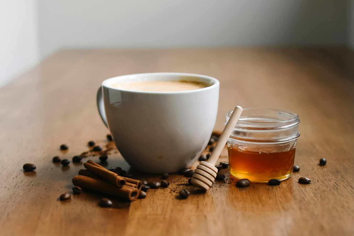 A cup of chai tea with Instant Masala Chai Tea Mix and honey.