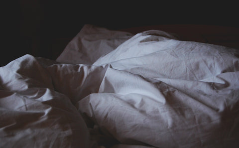 Dark Unmade Bed