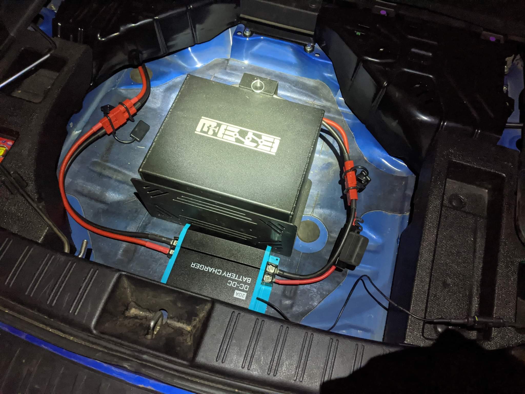 Lithium ion car battery relocated and mounted in the trunk of a WRX