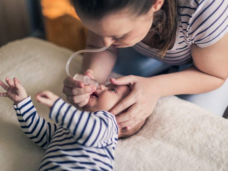 Moms Removing Baby Boogers with Mouth Nose Sucker