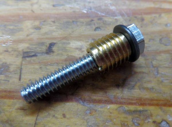 A 1-1/4" long hex bolt with a washer and insert threaded onto it.